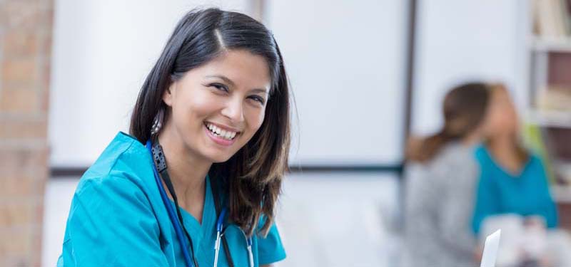 Happy Nurse Looking at Camera