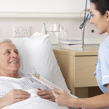 Bedside nurse with patient