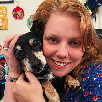 Joanna Allen-Boyd with her service dog Spencer.